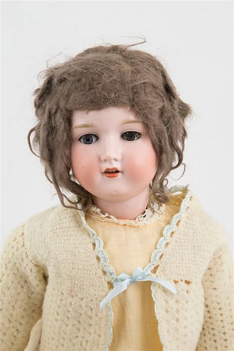 Armand marseille dolls - This is a lovely and large 32" antique Armand Marseille doll with very pretty features and blue sleep eyes. Full of character, she is marked to the back of the head 'A 14 M' and has the original antique auburn mohair wig.